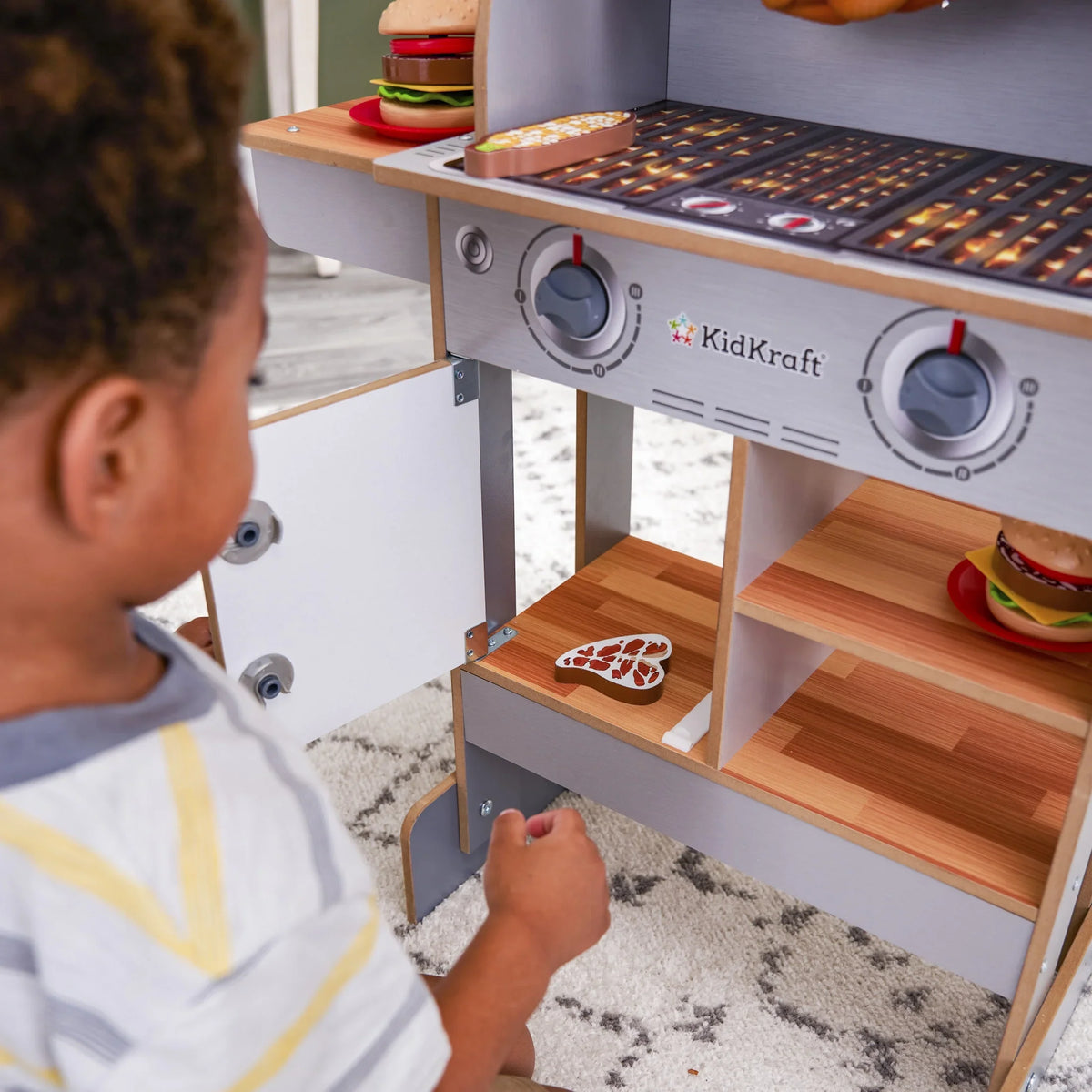KidKraft Spin & Reveal Wooden Grill & Play Kitchen with moisture-Reveal Food & 21 Accessories